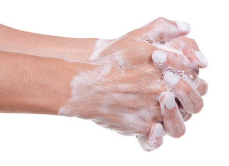 Washing hands with soap, foam on skin, isolated on white background.