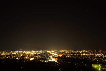 Fototapeta premium Aerial night panorama of the town called, SUWA in Nagano, Japan