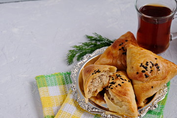 Samsa or Sambousak an oriental meal to be stuffed with minced meat, cheese or vegetables. The national dish of Uzbekistan is samsa with greens. Tasty, healthy, spring dish.