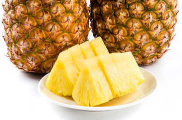 Slice of pineapple on white dish