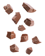 Pieces of delicious milk chocolate falling on white background