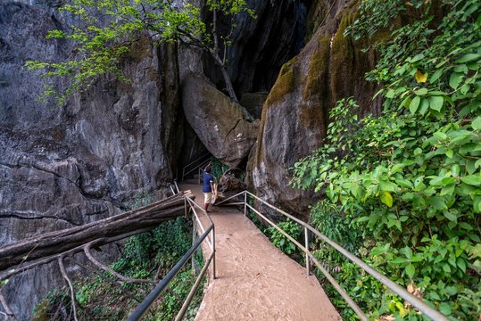 magical trails through a mountain forest in a tourist place Yana Rocks this is an old stone formation with caves inside. Karnataka. India. Indian tourism concept