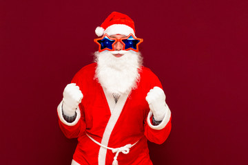 Holly jolly x-mas, confidence, magic, triumph concept. Cool funny playful biddle aged man shows win gesture