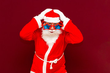 Sales, marketing,selling time! Santa is gesturing with hands hands on head red wall.