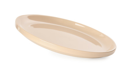 Clean empty beige plate isolated on white