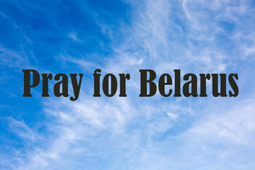 words Pray for Belarus on Sky background
