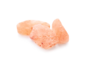 Crystals of pink himalayan salt isolated on white