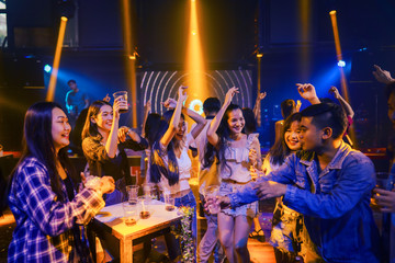 group of young people have fun enjoy party and dancing in night club