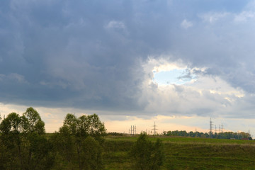 Landscape with a hole in the sky covered with clouds