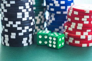 Playing dice and poker chips stacks