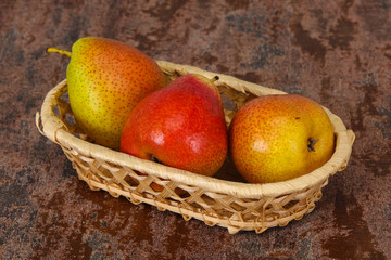 Pear heap in the wooden basket