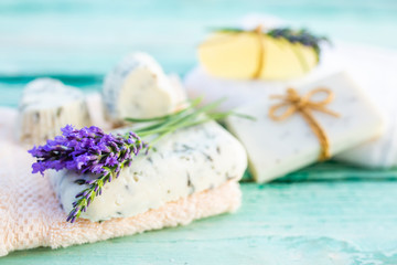 Homemade fragrant soaps with lavender flowers.