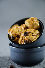 Coffee ice cream from aquafaba in a gray bowl. Sugar, lactose, gluten free.