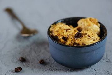 Coffee ice cream from aquafaba on a gray table. Sugar, lactose, gluten free.