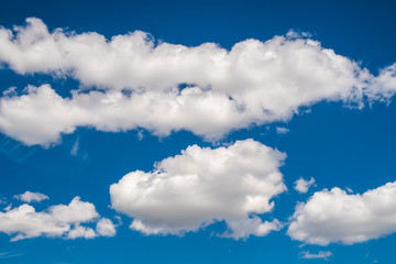 Images of a blue sky with white clouds