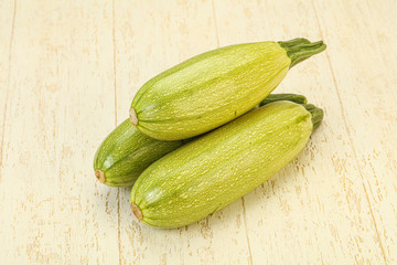 Young tasty zucchini over board