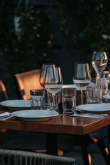 Glasses of white and pink sparkling wine on the table at the restaurant. Special wine tasting.