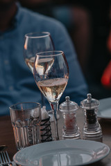 Glasses of white and pink sparkling wine on the table at the restaurant. Special wine tasting.