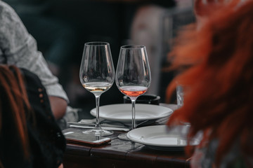 Glasses of white and pink sparkling wine on the table at the restaurant. Special wine tasting.