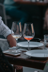 Glasses of white and pink sparkling wine on the table at the restaurant. Special wine tasting.