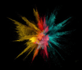 Colorful powder explosion isolated on black background