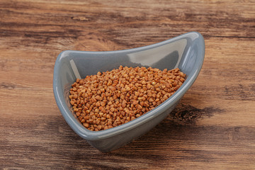 Raw buсkwheat cereal in the bowl