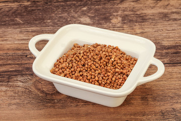 Raw buсkwheat cereal in the bowl