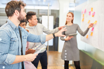 Creative start-up team discusses strategy planning