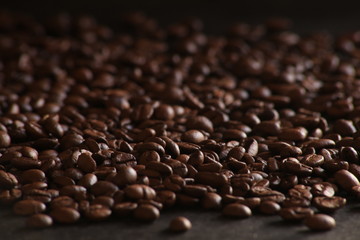 Coffee beans close up in dark ground