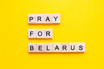 words Pray for Belarus on blue background