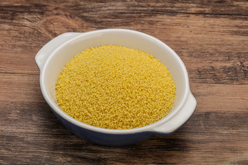 Raw cous cous heap in the bowl