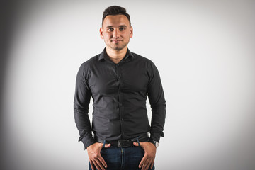 Fototapeta premium young emotional man shows hand gestures, isolated on a white background there is a place for the inscription text 