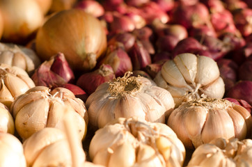 Garlic, Onion And Spices on wooden background. Selective focus.