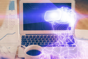 Computer on desktop with AR theme icon. Multi exposure. Concept of augmented reality.