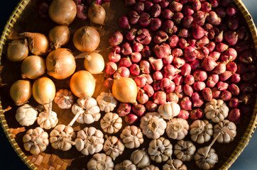 Garlic, Onion And Spices on wooden background. Selective focus.
