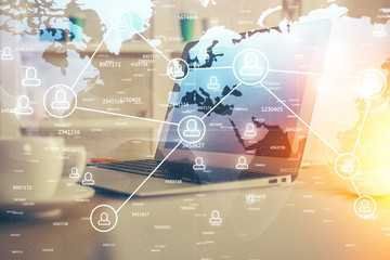 Computer on desktop with social network theme icon. Multi exposure. Concept of international connections.