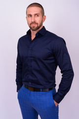 Fototapeta premium Portrait of handsome bald bearded businessman looking away