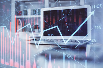 Forex market chart hologram and personal computer background. Multi exposure. Concept of investment.
