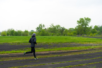 Man jogging in the stadium