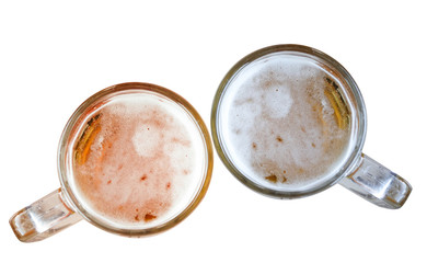 Two Fresh beer in mugs isolated on background