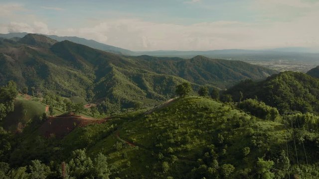 Stuning aerial mountain valley with farm fields sunset time