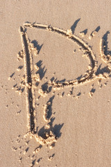 P - Alphabet letter written on sand