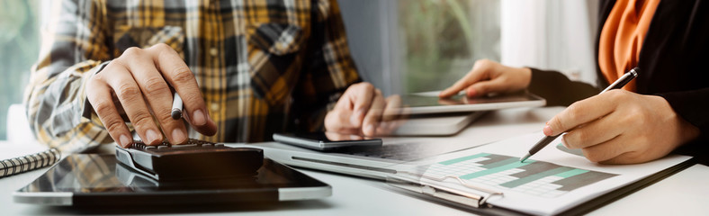 businesswoman hand using smart phone,mobile p payments online shopping,omni channel,digital tablet docking keyboard computer at office in sun light