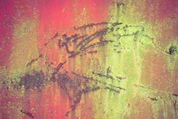 Bright colorful background from rusty metal with red and yellow green shabby cracked paint, Grunge metal background, vintage