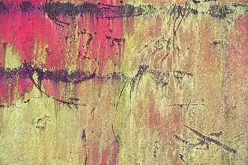 Bright colorful background from rusty metal with red and yellow green shabby cracked paint, Grunge metal background, vintage