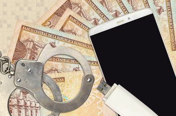 20 Dominican peso bills and smartphone with police handcuffs. Concept of hackers phishing attacks,...
