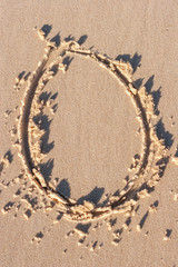 O - Alphabet letter written on sand