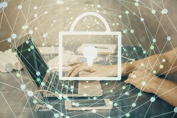 Double exposure of lock icon with man working on computer on background. Concept of network security.
