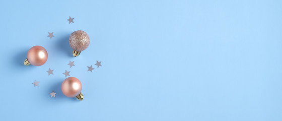 Christmas banner mockup. Blue Xmas background with decorations, balls, confetti stars. Christmas, New Year, winter holiday sales concept.