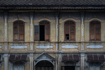 Beautiful ancient wooden stencil engraving windows and stucco pattern with and old yellow...